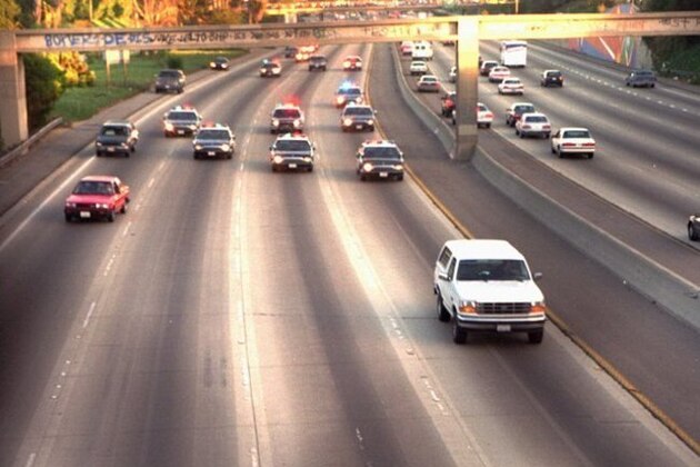FILE- A white Ford Bronco, driven by Al Cowlings and carrying O.J. Simpson, is trailed by police cars as it travels on a southern California freeway on June 17, 1994, in Los Angeles.  Cowlings and Simpson led authorities on a chase after Simpson was charged with two counts of murder in the deaths of his ex-wife and her friend.  (AP Photo/Joseph Villarin)
