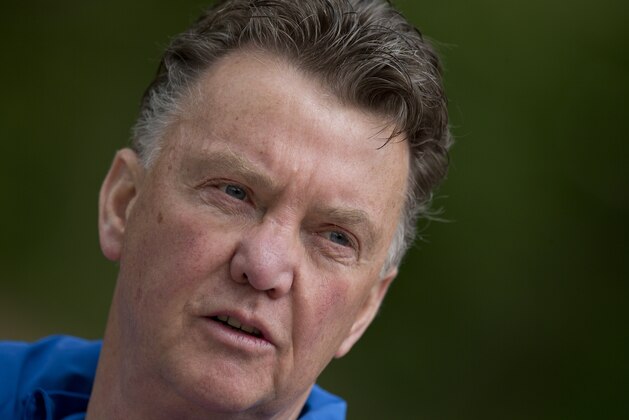 Louis van Gaal, coach of the Dutch national soccer team walks towards the mixed zone after a team training in Hoenderloo, eastern Netherlands, Thursday, May 15, 2014. The 62-year-old coach, who is widely expected to be the manager of Manchester United next season, has been experimenting in recent days with a new formation which he says may sound more defensive, but will be executed according to the