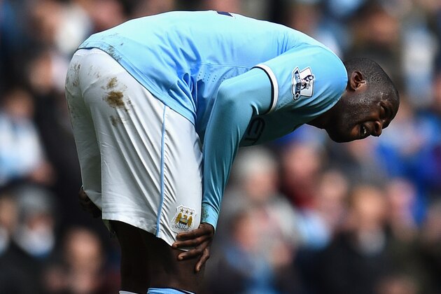MANCHESTER, ENGLAND - MAY 11:  Yaya Toure of Manchester City reacts after sustaining an injury during the Barclays Premier League match between Manchester City and West Ham United at the Etihad Stadium on May 11, 2014 in Manchester, England.  (Photo by Shaun Botterill/Getty Images)