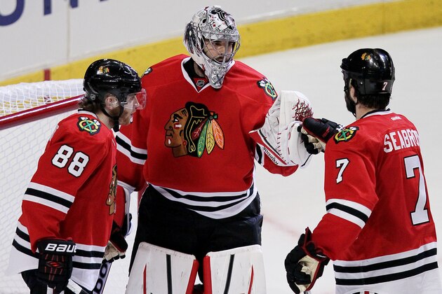 CHICAGO, IL - MAY 18:  Corey Crawford #50 celebrates with Patrick Kane #88 and Brent Seabrook #7 of the Chicago Blackhawks celebrate their 3 to 1 win over the Los Angeles Kings in Game One of the Western Conference Final during the 2014 Stanley Cup Playoffs at United Center on May 18, 2014 in Chicago, Illinois.  (Photo by Tasos Katopodis/Getty Images)