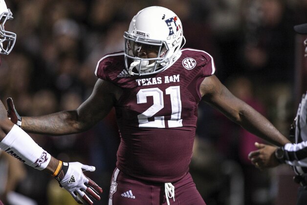 Nov 2, 2013; College Station, TX, USA; Texas A&M Aggies running back Tra Carson (21) celebrates after rushing for a touchdown during the second quarter against the UTEP Miners at Kyle Field. Mandatory Credit: Troy Taormina-USA TODAY Sports
