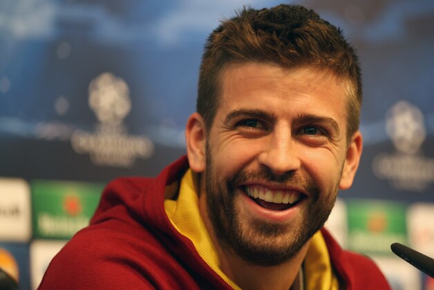 MANCHESTER, ENGLAND - FEBRUARY 17:  Gerard Pique of Barcelona in good spirits during a press conference prior to a training session ahead of their UEFA Champions League Round of 16 match 1st leg against Manchester City at Etihad Stadium on February 17, 2014 in Manchester, England.  (Photo by Clive Brunskill/Getty Images)