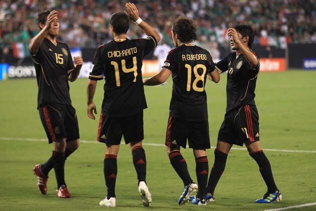 CHARLOTTE, NC - JUNE 09:  Hector Moreno #15 celebrates with teammate Javier Hernandez #13 of Mexico after a goal during their game in the CONCACAF Gold Cup at Bank of America Stadium on June 9, 2011 in Charlotte, North Carolina.  (Photo by Streeter Lecka/Getty Images)