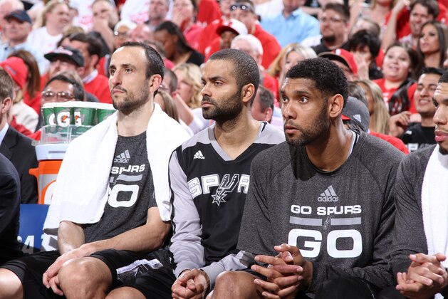 PORTLAND, OR - MAY 12:  Manu Ginobili #20, Tony Parker #9 and Tim Duncan #21 of the San Antonio Spurs sit on the bench in Game Four of the Western Conference Semifinals against the Portland Trail Blazers during the 2014 NBA Playoffs on May 12, 2014 at the Moda Center in Portland, Oregon. NOTE TO USER: User expressly acknowledges and agrees that, by downloading and or using this photograph, User is consenting to the terms and conditions of the Getty Images License Agreement. Mandatory Copyright Notice: Copyright 2014 NBAE (Photo by Sam Forencich/NBAE via Getty Images)