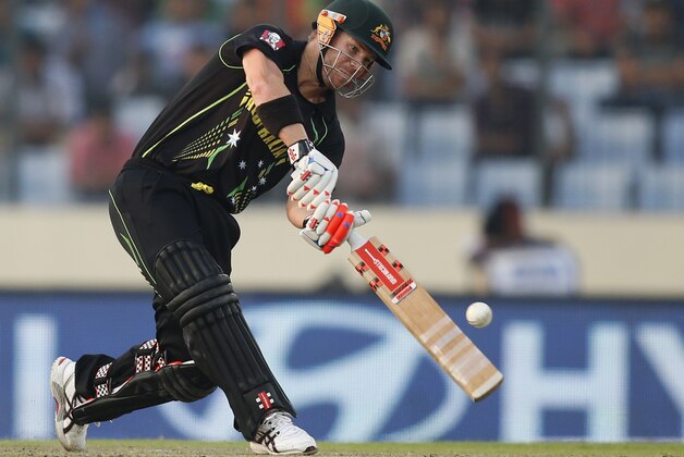 Australia batsman David Warner plays a shot during their ICC Twenty20 Cricket World Cup match against Bangladesh in Dhaka, Bangladesh, Tuesday, April 1, 2014. (AP Photo/Aijaz Rahi)