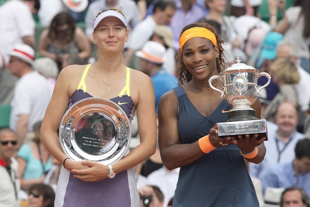 Jun 8, 2013; Paris, France; Serena Williams (USA), right, and Maria Sharapova (RUS) pose with their trophies after their match on day 14 of the 2013 French Open at Roland Garros. Mandatory Credit: Susan Mullane-USA TODAY Sports