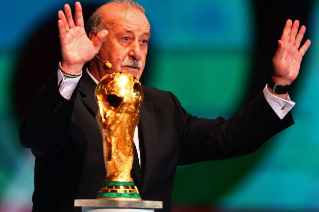 COSTA DO SAUIPE, BRAZIL - DECEMBER 06:  Spain coach Vicente del Bosque places the World Cup trophy on a plinth on stage before the Final Draw for the 2014 FIFA World Cup Brazil at Costa do Sauipe Resort on December 6, 2013 in Costa do Sauipe, Bahia, Brazil.  (Photo by Clive Mason/Getty Images)