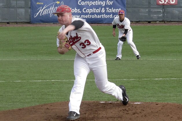In this photo made Saturday, March 29, 2014, University of Hartford pitcher Sean Newcomb delivers during a baseball game against Stony Brook in Hartford, Conn.  The 6-foot-5 left hander is considered a top major-league prospect. (AP Photo/Pat Eaton-Robb)