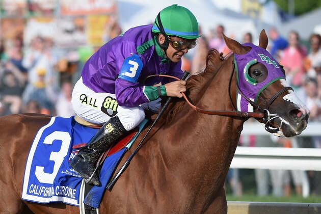 BALTIMORE, MD - MAY 17:  California Chrome #3, ridden by Victor Espinoza, races to the finishline to win the 139th running of the Preakness Stakes at Pimlico Race Course on May 17, 2014 in Baltimore, Maryland.  (Photo by Molly Riley/Getty Images)