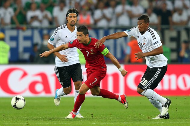 L'VIV, UKRAINE - JUNE 09:  Cristiano Ronaldo of Portugal and Jerome Boateng of Germany during the UEFA EURO 2012 group B match between Germany and Portugal at Arena Lviv on June 9, 2012 in L'viv, Ukraine.  (Photo by Alex Livesey/Getty Images)
