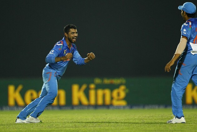 India’s Ravindra Jadeja, left, celebrates the wicket of Sri Lanka’s Dinesh Chandimal during the Asia Cup one-day international cricket tournament in Fatullah, near Dhaka, Bangladesh, Friday, Feb. 28, 2014. (AP Photo/A.M. Ahad)