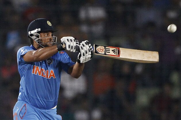 India's Suresh Raina plays a shot during their ICC Twenty20 Cricket World Cup semifinal match against South Africa in Dhaka, Bangladesh, Friday, April 4, 2014.(AP Photo/A.M. Ahad)