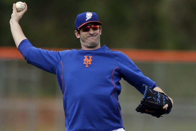FILE - In this Feb. 22, 2014 file photo, New York Mets pitcher Matt Harvey plays catch during spring training baseball practice in Port St. Lucie, Fla. The Mets and Harvey have agreed where the pitcher will rehabilitate from elbow ligament-replacement surgery. General manager Sandy Alderson said Tuesday, March 25, 2014, the right-hander will be with the club in New York during homestands and work at the team's spring training complex in Port St. Lucie when the Mets are on the road. (AP Photo/Jeff Roberson, File) FILE - In this Feb. 22, 2014 file photo, New York Mets pitcher Matt Harvey plays catch during spring training baseball practice in Port St. Lucie, Fla. The Mets and Harvey have agreed where the pitcher will rehabilitate from elbow ligament-replacement surgery. General manager Sandy Alderson said Tuesday, March 25, 2014, the right-hander will be with the club in New York during homestands and work at the team's spring training complex in Port St. Lucie when the Mets are on the road. (AP Photo/Jeff Roberson, File)