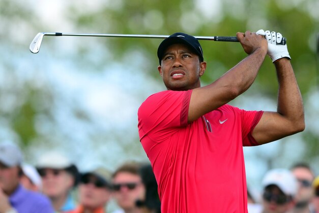 Mar 9, 2014; Miami, FL, USA; Tiger Woods tees off from the 4th hole during the final round of the WGC - Cadillac Championship golf tournament at TPC Blue Monster at Trump National Doral. Mandatory Credit: Andrew Weber-USA TODAY Sports
