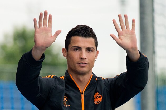MADRID, SPAIN - MAY 20:  Cristiano Ronaldo of Real Madrid CF greets the media during the Real Madrid media day, prior to UEFA Champions League final against Club Atletico de Madrid, at Valdebebas Sport City on May 20, 2014 in Madrid, Spain.  (Photo by Gonzalo Arroyo Moreno/Getty Images)