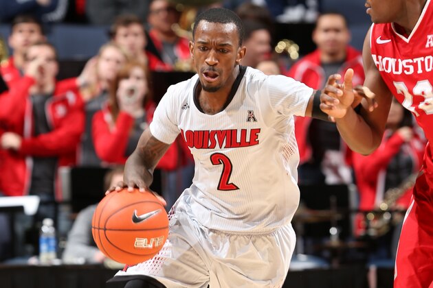 MEMPHIS, TN - MARCH 14: Russ Smith #2 of the Louisville Cardinals dribbles the ball upcourt against the Houston Cougars during the semifinals of the American Athletic Conference Tournament at FedExForum on March 14, 2014 in Memphis, Tennessee. (Photo by Joe Murphy/Getty Images)