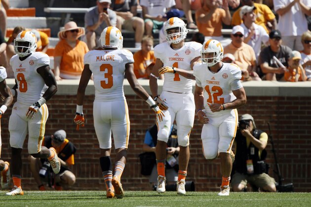 Tennessee running back Jalen Hurd (1) is congratulated by Josh Malone (3) after scoring a touchdown during the annual Orange and White NCAA college spring football game on Saturday, April 12, 2014, in Knoxville, Tenn. (AP Photo/Wade Payne)