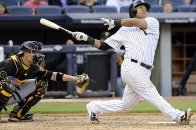 New York Yankees' Yangervis Solarte hits a home run as Pittsburgh Pirates catcher Chris Stewart, left, looks on during the sixth inning of the second game of a baseball double-header Sunday, May 18, 2014, at Yankee Stadium in New York. (AP Photo/Bill Kostroun)