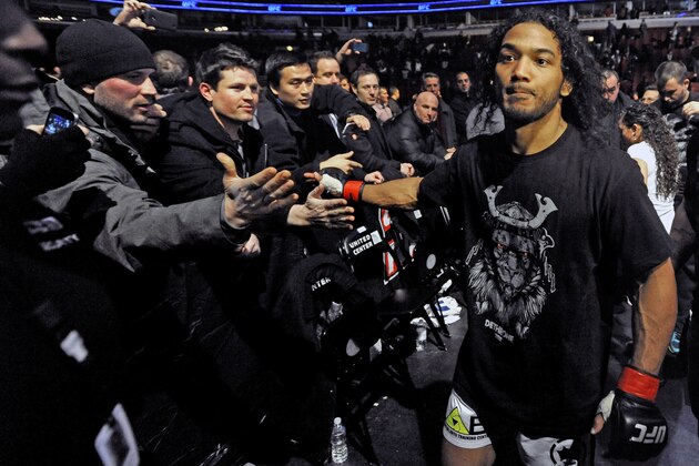 Benson Henderson celebrates with fans after defeating Josh Thomson during the main event of the UFC mixed martial arts match in Chicago, Saturday, Jan., 25, 2014. (AP Photo/Paul Beaty)