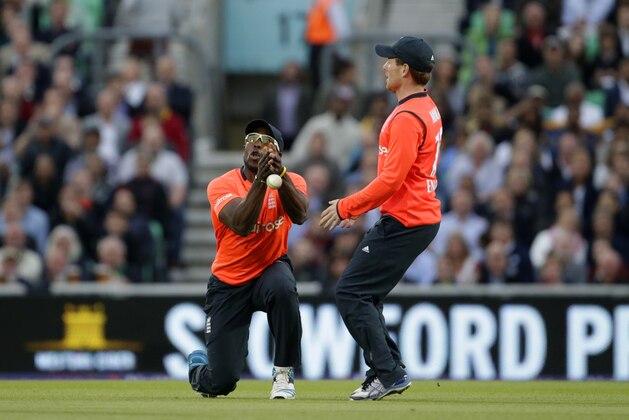 Michael Carberry, left, drops a catch beside his captain Eoin Morgan off the batting of Sri Lanka's Nuwan Kulasekara during the Twenty20 cricket match between England and Sri Lanka at the Oval cricket ground in London, Tuesday, May 20, 2014.  (AP Photo/Matt Dunham)