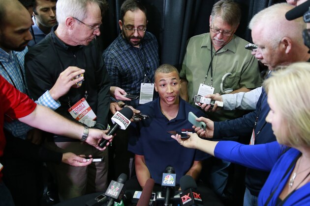 Dante Exum from Australia meets with reporters at the 2014 NBA basketball Draft Combine Thursday, May 15, 2014, in Chicago. Exum did not participate in his scheduled workout Thursday. (AP Photo/Charles Rex Arbogast)