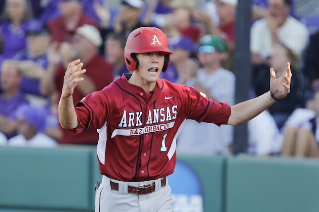 Arkansas' Brian Anderson celebrates after scoring a run against Kansas State in the first inning in an NCAA baseball regional game in Manhattan, Kan., Sunday, June 2, 2013. (AP Photo/Jeff Tuttle)