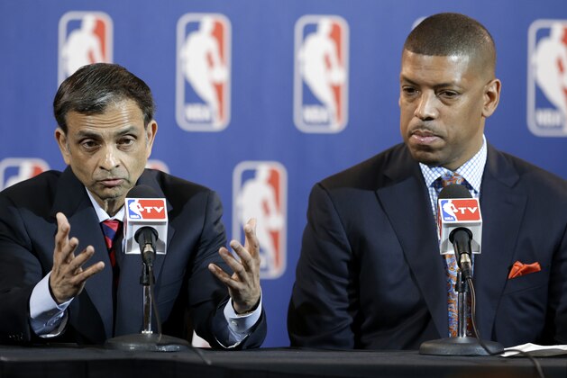 FILE- In this Wednesday, May 15, 2013, file photo, Sacramento, Calif., Mayor Kevin Johnson, right, listens as software tycoon Vivek Ranadive, left, address reporters during a news conference following the NBA Board of Governors meeting in Dallas. Johnson said Friday, May 17, 2013, that the deal to sell the Sacramento Kings to a group led by  Ranadive has been signed.  Johnson helped assemble the new ownership group in a bid to keep the Kings in California's capital city, a feat that was accomplished earlier in the week when NBA owners rejected a bid to move the franchise to Seattle.  (AP Photo/Tony Gutierrez, File)