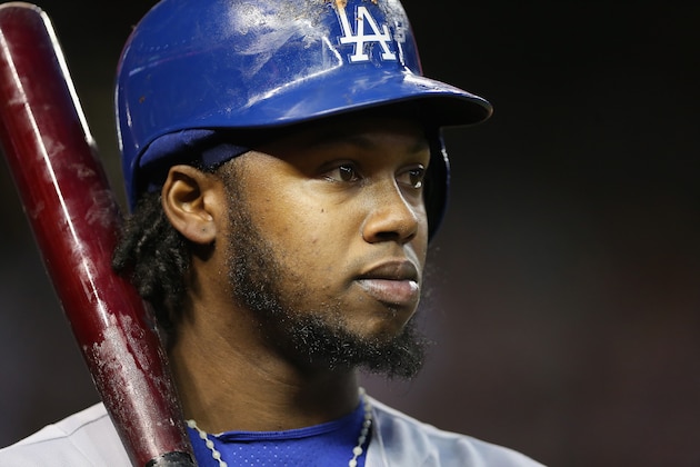PHOENIX, AZ - MAY 17:  Hanley Ramirez #13 of the Los Angeles Dodgers on deck during the MLB game against the Arizona Diamondbacks at Chase Field on May 17, 2014 in Phoenix, Arizona.  The Diamondbacks defeated the Dodgers 18-7. (Photo by Christian Petersen/Getty Images)