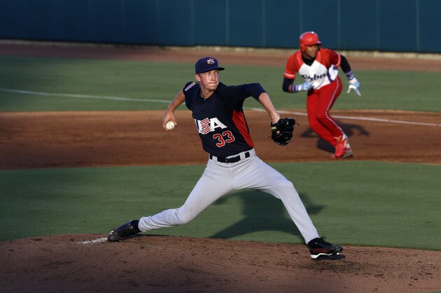United States pitcher Erick Fedde (33) winds up during the second inning of an exhibition baseball game against Cuba in Cary, N.C., Monday, July 22, 2013. (AP Photo/Gerry Broome)
