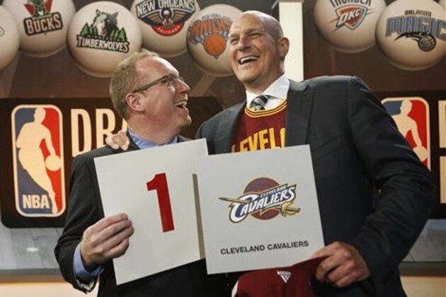 Cleveland Cavaliers general manager David Griffin, left, and minority owner Jeff Cohen celebrate after the Cavaliers won the top pick in the the NBA basketball draft lottery in New York, Tuesday, May 20, 2014. It's the third time in four years the Cavs will be atop the draft after moving up from the ninth spot. (AP Photo/Kathy Willens)
