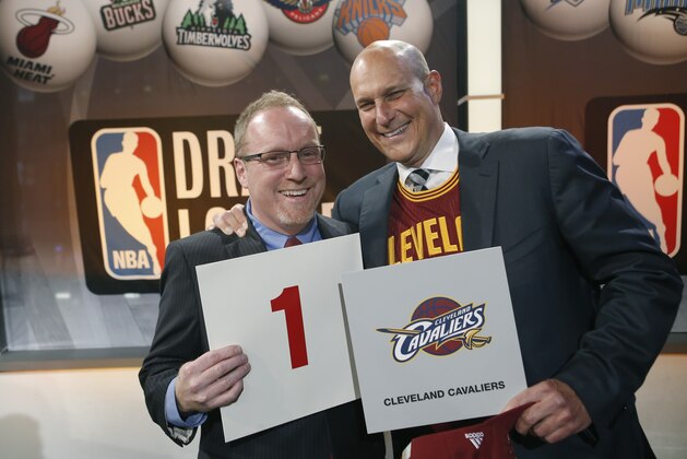 Cleveland Cavaliers general manager David Griffin, left, and minority owner Jeff Cohen celebrate after the Cavaliers won the top pick in the the NBA basketball draft lottery in New York, Tuesday, May 20, 2014. It's the third time in four years the Cavs will be atop the draft after moving up from the ninth spot. (AP Photo/Kathy Willens)
