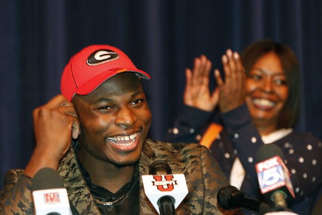 Norcross High School defensive end Lorenzo Carter announces that he plans to play NCAA college football at Georgia during a news conference Wednesday, Feb. 5, 2014, in Atlanta. Carter is regarded as the top prospect in Georgia and one of the top pass-rushers in the nation. (AP Photo/John Bazemore)