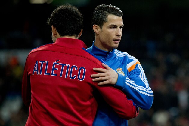MADRID, SPAIN - FEBRUARY 05:  Cristiano Ronaldo (R) of Real Madrid CF embraces Diego Costa (L) of Atletico de Madrid prior to start prior to start the Copa del Rey semifinal first leg match between Real Madrid CF and Club Atletico Madrid at Estadio Santiago Bernabeu on February 5, 2014 in Madrid, Spain.  (Photo by Gonzalo Arroyo Moreno/Getty Images)