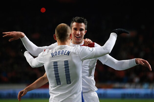 AMSTERDAM, NETHERLANDS - MARCH 26:  Robin Van Persie (#9) of Netherlands celebrates with team mate Arjen Robben after scoring the second goal of the game during the the Group 4 FIFA 2014 World Cup Qualifier match between Netherlands and Romania at Amsterdam Arena on March 26, 2013 in Amsterdam, Netherlands.  (Photo by Dean Mouhtaropoulos/Getty Images)