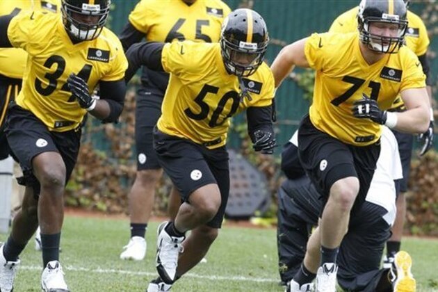 Pittsburgh Steelers linebacker Ryan Shazier (50), the team's first round draft pick from Ohio State, goes through drills with linebacker Howard Jones (34) out of Shepherd, and defensive end Josh Mauro (71), out of Stanford, during NFL football rookie camp at the team's practice facility Friday, May 16, 2014, in Pittsburgh. (AP Photo/Keith Srakocic)