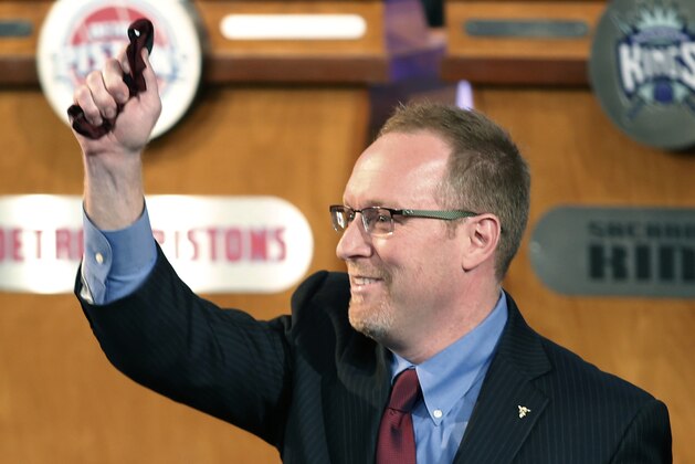 Cleveland Cavaliers general manager David Griffin holds a lucky bow tie after the Cavaliers won the first pick in the NBA draft lottery, in New York on Tuesday, May 20, 2014. The bowtie was worn by Nick Gilbert, son of Cavaliers owner Dan Gilbert, who represented the Cavs in the previous draft lottery, when they also won the first pick. It's the third time in four years the Cavs will be atop the draft after moving up from the ninth spot.  (AP Photo/Kathy Willens)