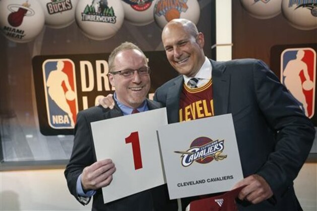 Cleveland Cavaliers general manager David Griffin, left, and minority owner Jeff Cohen celebrate after the Cavaliers won the top pick in the the NBA basketball draft lottery in New York, Tuesday, May 20, 2014. It's the third time in four years the Cavs will be atop the draft after moving up from the ninth spot. (AP Photo/Kathy Willens)