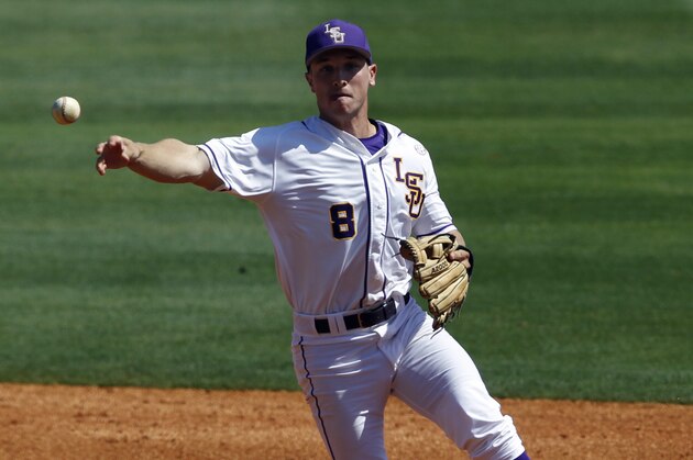 LSU's Alex Bregman (8) throws to first for the out against Vanderbilt during the third inning at the Southeastern Conference NCAA college baseball tournament on Wednesday, May 21, 2014, in Hoover, Ala. (AP Photo/Butch Dill)