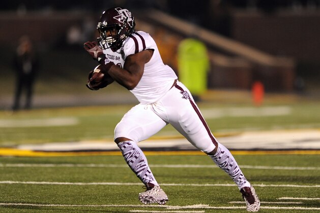 Texas A&M running back Tra Carson runs for a 29-yard touchdown during the first quarter of an NCAA college football game against Missouri on Saturday, Nov. 30, 2013, in Columbia, Mo. (AP Photo/L.G. Patterson)