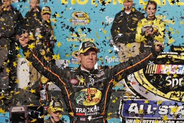 Jamie McMurray celebrates in Victory Lane after winning the NASCAR Sprint All-Star auto race at Charlotte Motor Speedway in Concord, N.C., Saturday, May 17, 2014. (AP Photo/Chuck Burton)