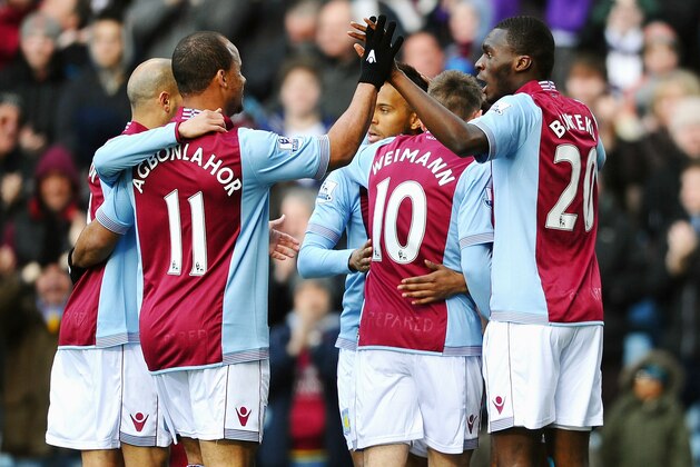 BIRMINGHAM, ENGLAND - MARCH 23:  Christian Benteke #20 (R) of Aston Villa celebrates with teammates after scoring the opening goal during the Barclays Premier League match between Aston Villa and Stoke City at Villa Park on March 23, 2014 in Birmingham, England.  (Photo by Laurence Griffiths/Getty Images)