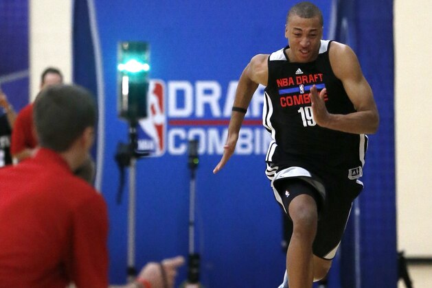 Dante Exum, from Australia, participates in the three-quarters-court sprint in the 2014 NBA basketball draft combine Friday, May 16, 2014, in Chicago. (AP Photo/Charles Rex Arbogast)