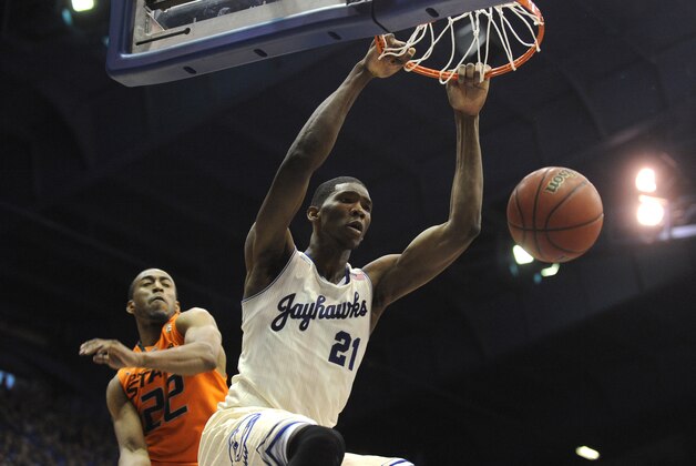 Jan 18, 2014; Lawrence, KS, USA; Kansas Jayhawks center Joel Embiid (21) dunks the ball against Oklahoma State Cowboys guard Markel Brown (22) in the second half at Allen Fieldhouse. Kansas won 80-78. Mandatory Credit: John Rieger-USA TODAY Sports Jan 18, 2014; Lawrence, KS, USA; Kansas Jayhawks center Joel Embiid (21) dunks the ball against Oklahoma State Cowboys guard Markel Brown (22) in the second half at Allen Fieldhouse. Kansas won 80-78. Mandatory Credit: John Rieger-USA TODAY Sports