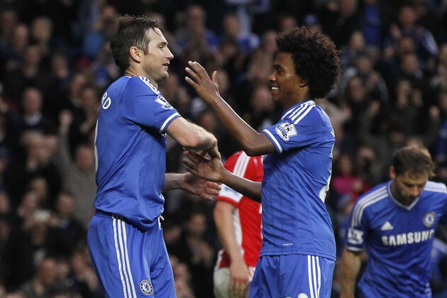 Chelsea's Frank Lampard, left, celebrates his goal against Stoke City with teammate Willian during their English Premier League soccer match at Stamford Bridge, London, Saturday, April 5, 2014. (AP Photo/Sang Tan)