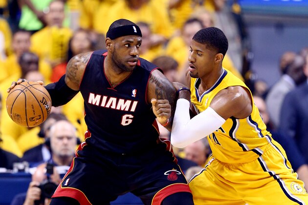 INDIANAPOLIS, IN - MAY 20:  LeBron James #6 of the Miami Heat controls the ball against Paul George #24 of the Indiana Pacers during Game Two of the Eastern Conference Finals of the 2014 NBA Playoffs at at Bankers Life Fieldhouse on May 20, 2014 in Indianapolis, Indiana. NOTE TO USER: User expressly acknowledges and agrees that, by downloading and or using this photograph, User is consenting to the terms and conditions of the Getty Images License Agreement.  (Photo by Andy Lyons/Getty Images)