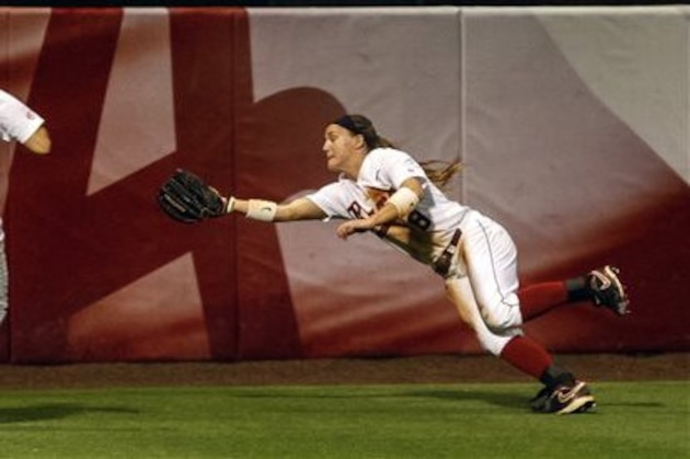 Alabama Outfielder Haylie McCleney (8) makes a leaping catch for an out during Alabama's NCAA softball regional game with Jacksonville State, Friday, May 17, 2013, at Rhoads Stadium in Tuscaloosa, Ala. Alabama won 4-0 to move on in the winner's bracket. (AP Photo/Alabama Media Group, Vasha Hunt)