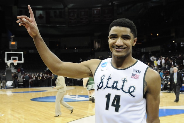 Mar 22, 2014; Spokane, WA, USA; Michigan State Spartans guard Gary Harris (14) celebrates after a men's college basketball game during the third round of the 2014 NCAA Tournament against the Harvard Crimson at Veterans Memorial Arena. The Spartans defeated the Crimson 80-73. Mandatory Credit: James Snook-USA TODAY Sports