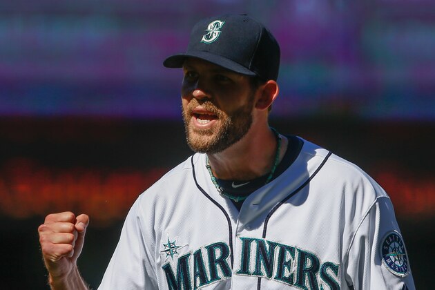 SEATTLE, WA - JULY 14:  Closing pitcher Tom Wilhelmsen #54 of the Seattle Mariners pumps his fist after inducing Erick Aybar of the Los Angeles Angels of Anaheim to line out for the final out at Safeco Field on July 14, 2013 in Seattle, Washington. The Mariners defeated the Angels 4-3.  (Photo by Otto Greule Jr/Getty Images)