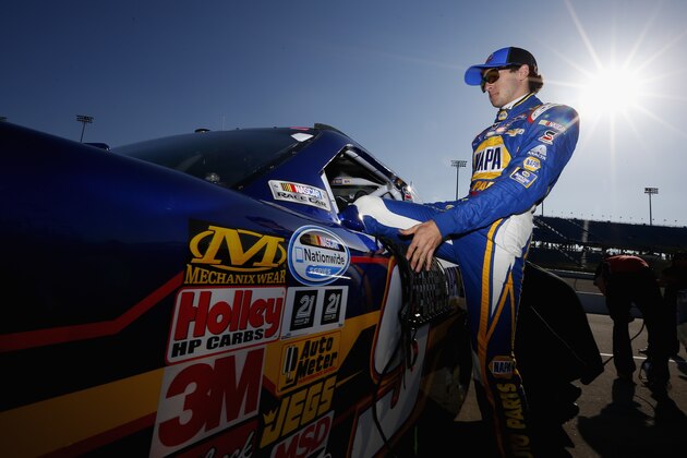 NEWTON, IA - MAY 17:  Chase Elliott, driver of the #9 NAPA Auto Parts Chevrolet, climbs into his car during practice for the NASCAR Nationwide Series Get To Know Newton 250 Presented By Sherwin Williams at Iowa Speedway on May 17, 2014 in Newton, Iowa.  (Photo by Matt Sullivan/Getty Images)