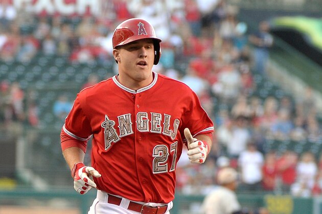 ANAHEIM, CA - MAY 17:  Mike Trout #27 of the Los Angeles Angels runs home to score on a sacrifice fly to take a 2-0 lead over the Tampa Bay Rays at Angel Stadium of Anaheim on May 17, 2014 in Anaheim, California.  (Photo by Harry How/Getty Images)